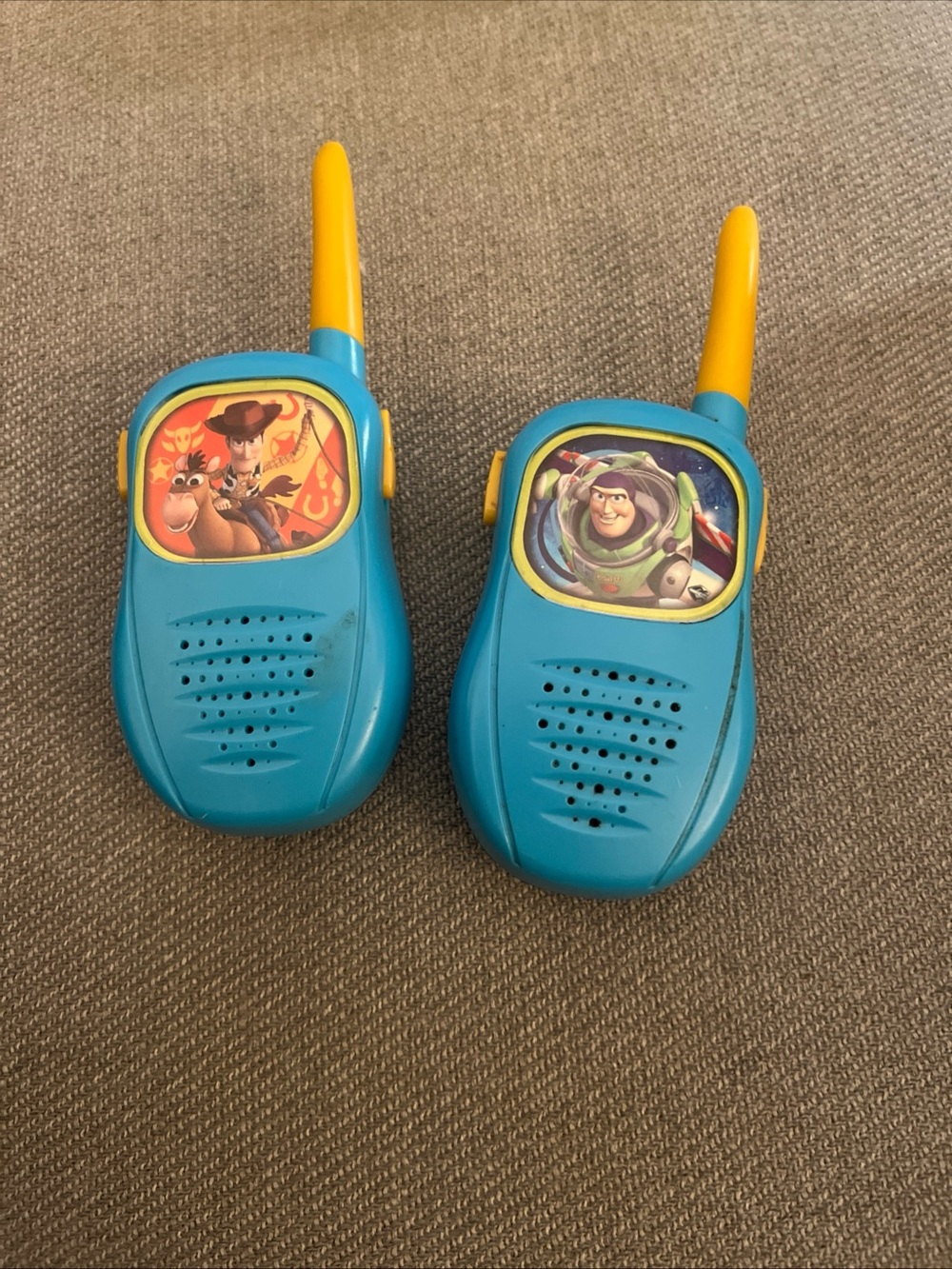 Toy Story walkie-talkies featuring Woody and Buzz Lightyear.